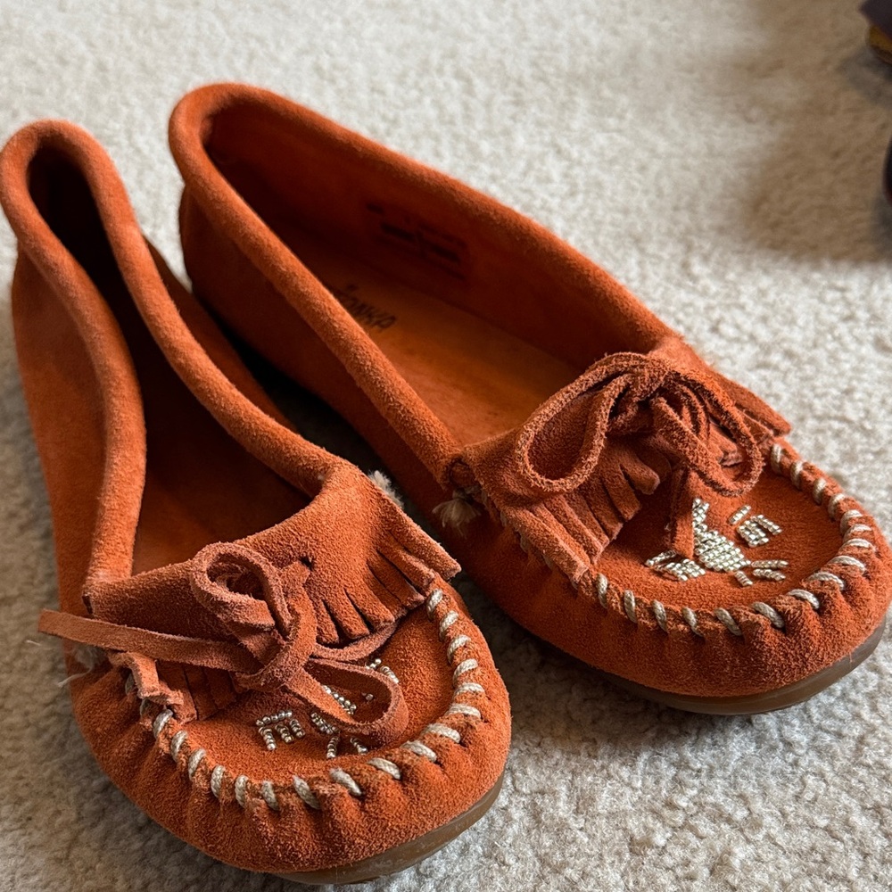 Minnetonka Suede Fringe Moccasins in Rust Orange